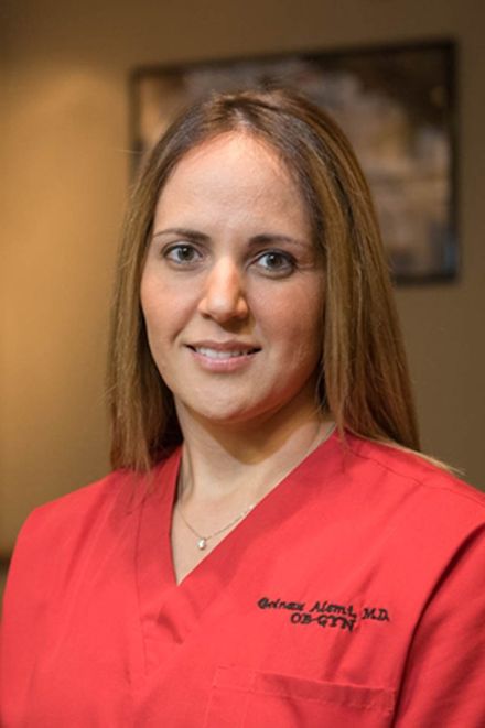 women doctor with red scrubs